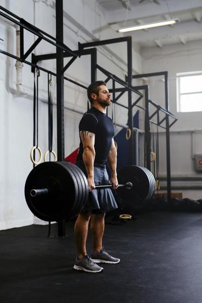 weightlifter-lifting-barbells-at-gym_9a5a084a-3609-11e6-b762-306eb096a216